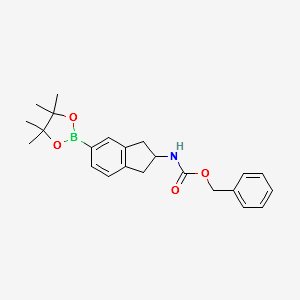 Benzyl N-[5-(tetramethyl-1,3,2-dioxaborolan-2-yl)-2,3-dihydro-1H-inden-2-yl]carbamate structure, CAS 2377587-35-2