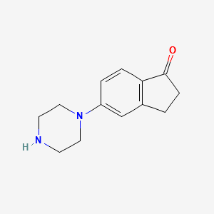 5-Piperazin-1-yl-indan-1-one structure, CAS 868245-03-8